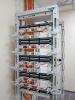 Телекоммуникационная стойка с панелями СКС и системой организации гибких кабелей